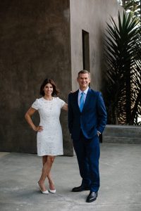 Dana Bambace and Mark Peterson posing for a team environmental portrait