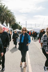 Julie Gardner posing for a environmental portrait at the treasure island flea market