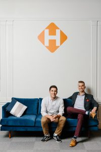 Environmental portrait of the two co-founders of Hinge Health on a couch.