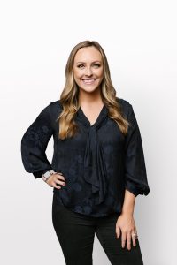 Smiling Silicon Valley Bank employee in a studio portrait.